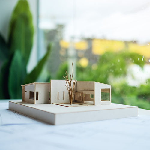 an-architecture-model-with-shop-drawing-paper-on-Real Estate Market in BC