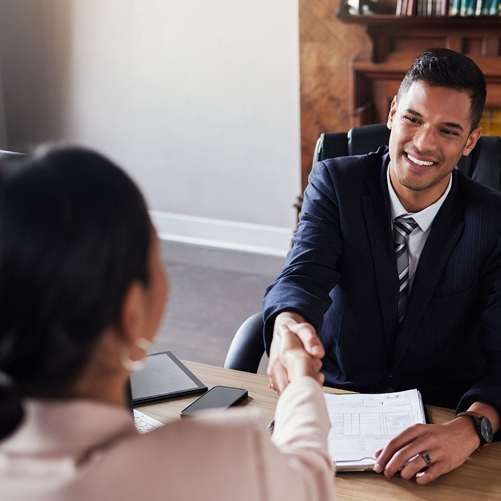 Affordable Home Insurance-Factors Affecting Home Insurance Premiums in BC-consultant-handshakes-with-client-meeting-in-office