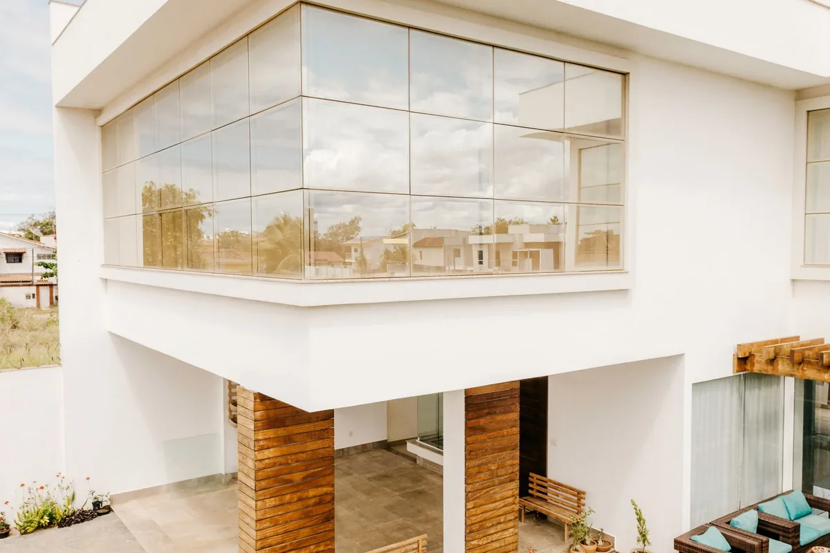 Contemporary luxury home with a glass facade and pool