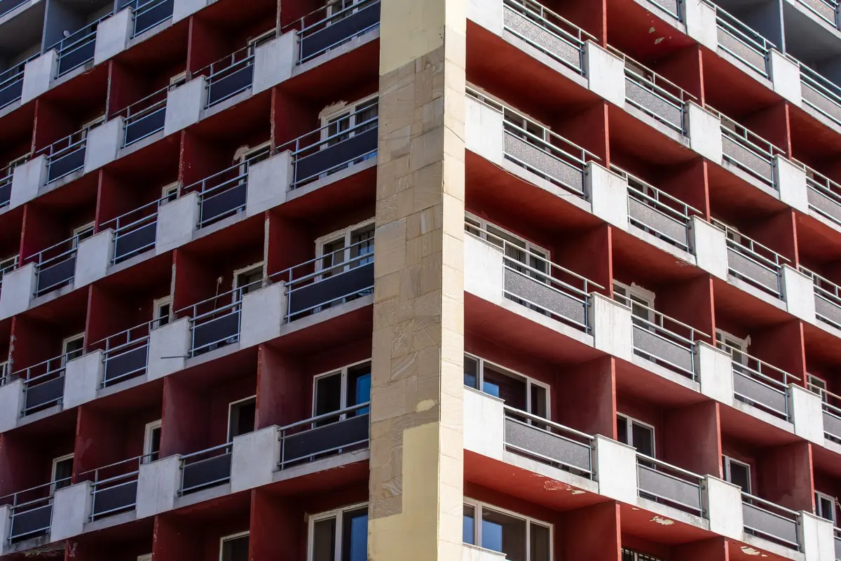 Urban apartment building with stacked balconies