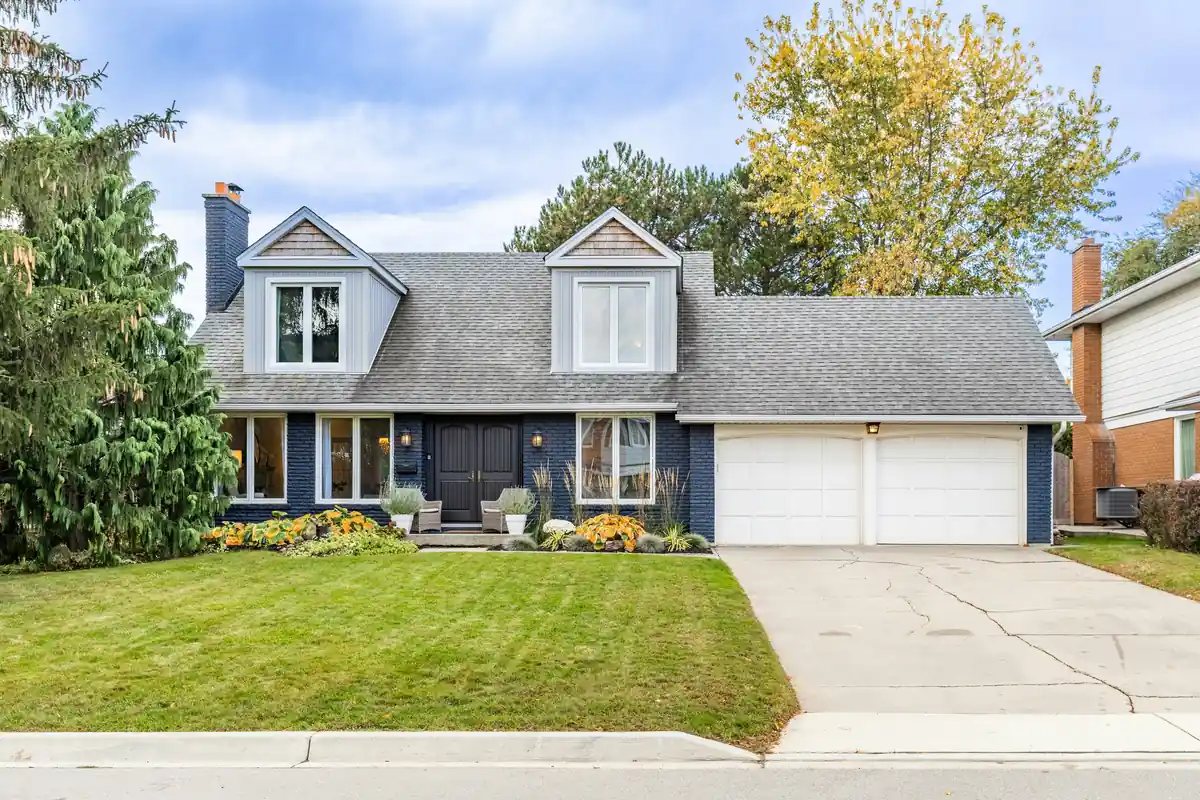Canadian suburban home with a lawn and garage