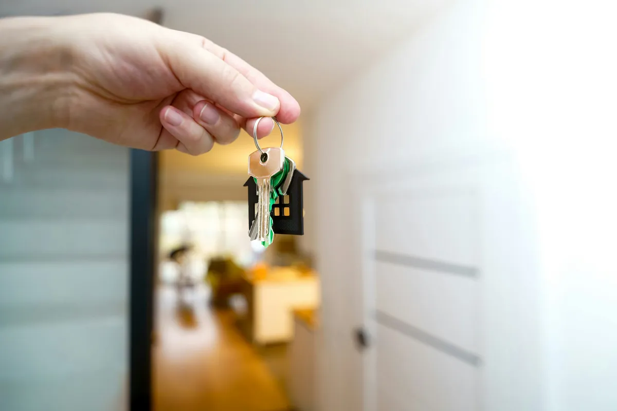 House key held inside a new home