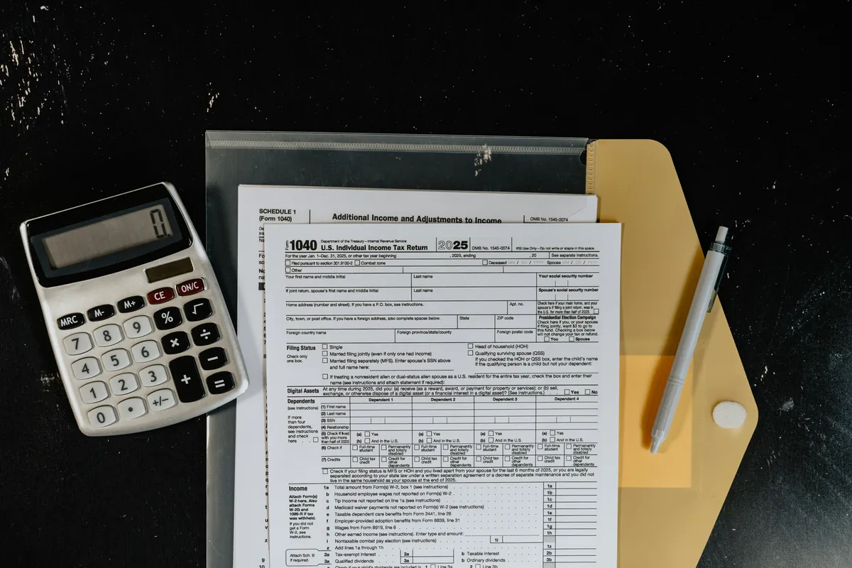 Navid Hakimi Group Speculation and Vacancy Tax in North Vancouver Explained 3 Calculator and tax forms on a desk