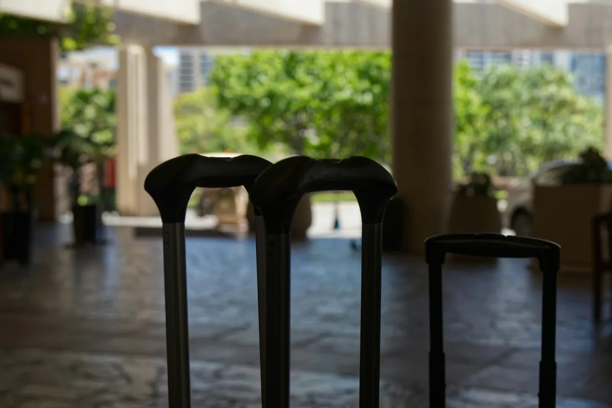 Navid Hakimi Group North Vancouver Short-Term Rental Rules | Owner Guide 3 Travel suitcases in a hotel lobby