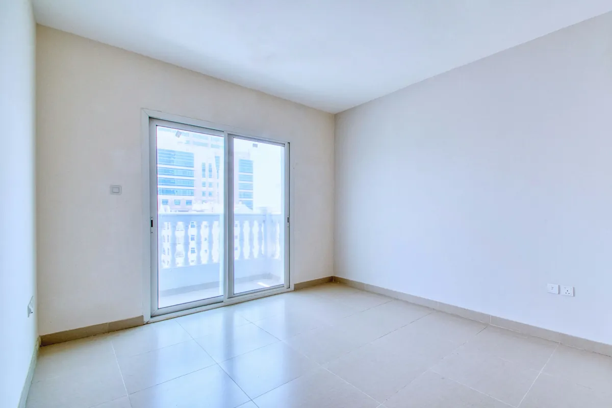 Navid Hakimi Group Speculation and Vacancy Tax in North Vancouver Explained 2 Empty apartment room with a balcony door