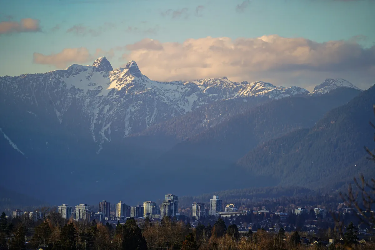 Vancouver skyline beneath snow-capped mountains