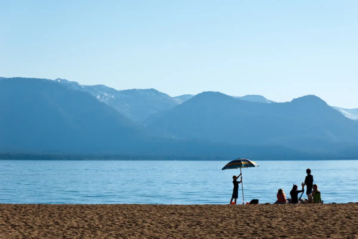 Families enjoying a busy waterfront during summer