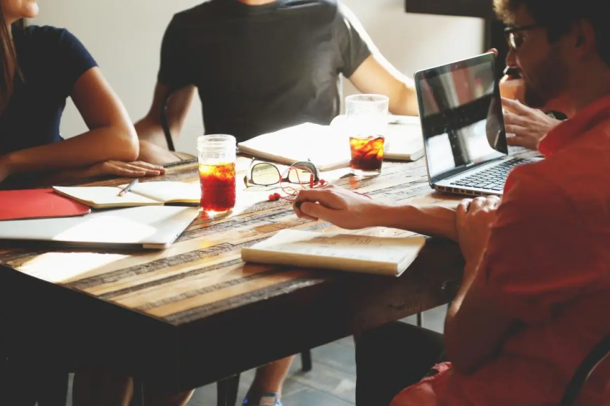 Navid Hakimi Group Deposit vs Down Payment in BC: How Much Do You Hand Over With Your Offer? 2 Buyers reviewing documents before delivering their home deposit