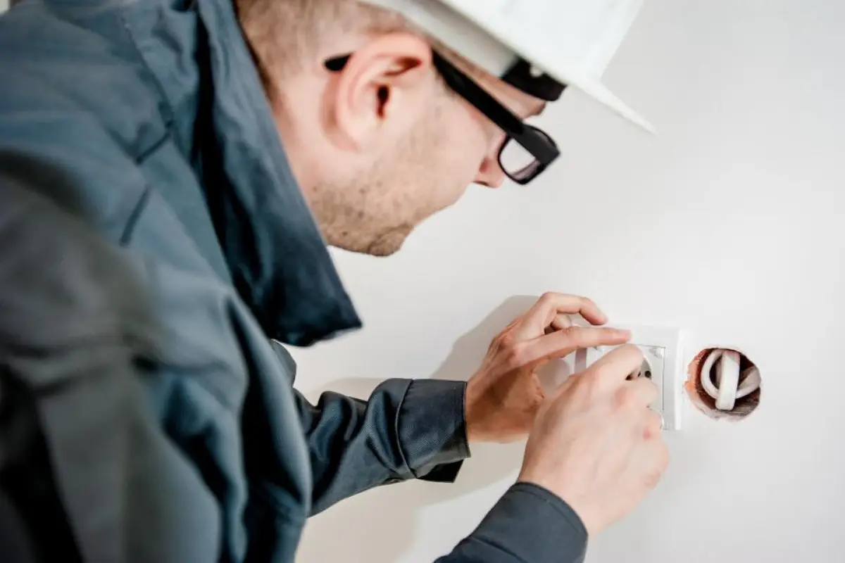 Navid Hakimi Group Home Appraisal vs Home Inspection in BC: Two Different Reports, Two Different Jobs 2 Professional inspecting electrical systems in a home