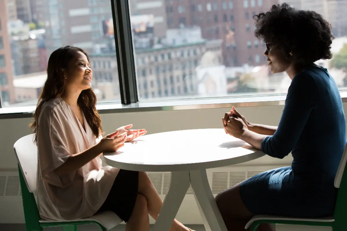 Homeowners interviewing a real estate professional
