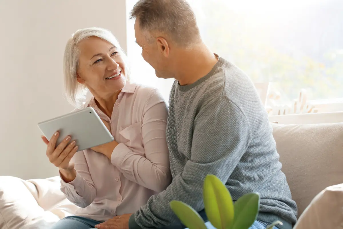 Navid Hakimi Group Reverse Mortgage or Downsize? A North Shore Homeowner's Comparison 2 Older couple reviewing the long term effect of a growing loan balance