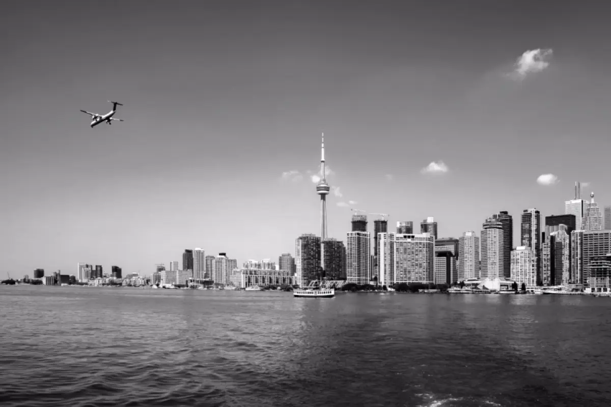 Navid Hakimi Group Moving From Toronto to Vancouver: What Your Housing Budget Actually Buys Here 1 Toronto skyline representing the housing market buyers are leaving