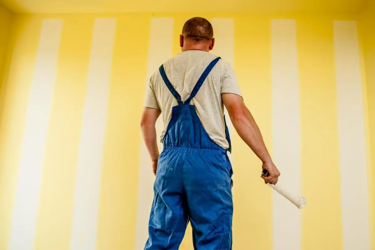 Tradesperson working on materials and systems in a new home