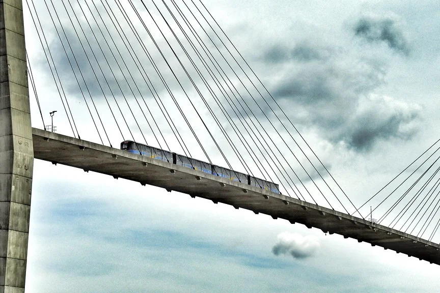 Navid Hakimi Group Best Neighbourhoods in Burnaby for Home Buyers (Ranked by Budget and Lifestyle) 3 SkyTrain crossing the Fraser River on its cable-stayed bridge in Metro Vancouver