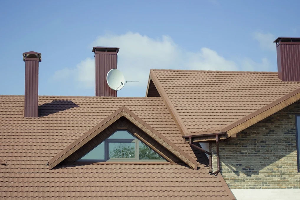 Navid Hakimi Group Buying a Duplex in North Vancouver | Side-by-Side vs Up/Down vs Strata 3 Close-up of a house roof with chimneys, a key item on a duplex inspection