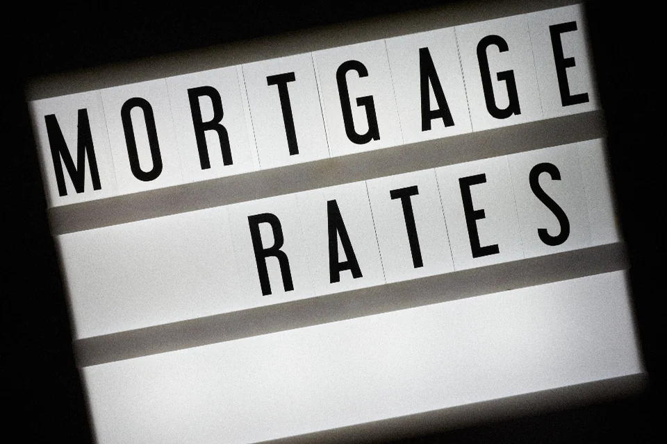 Lightbox sign reading Mortgage Rates, a key factor in the 2027 housing outlook